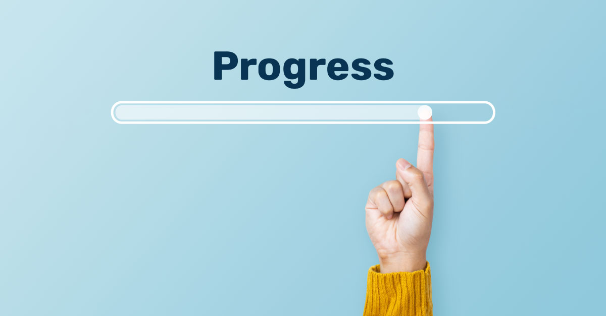 a hand moving a progress bar further and further to 100%