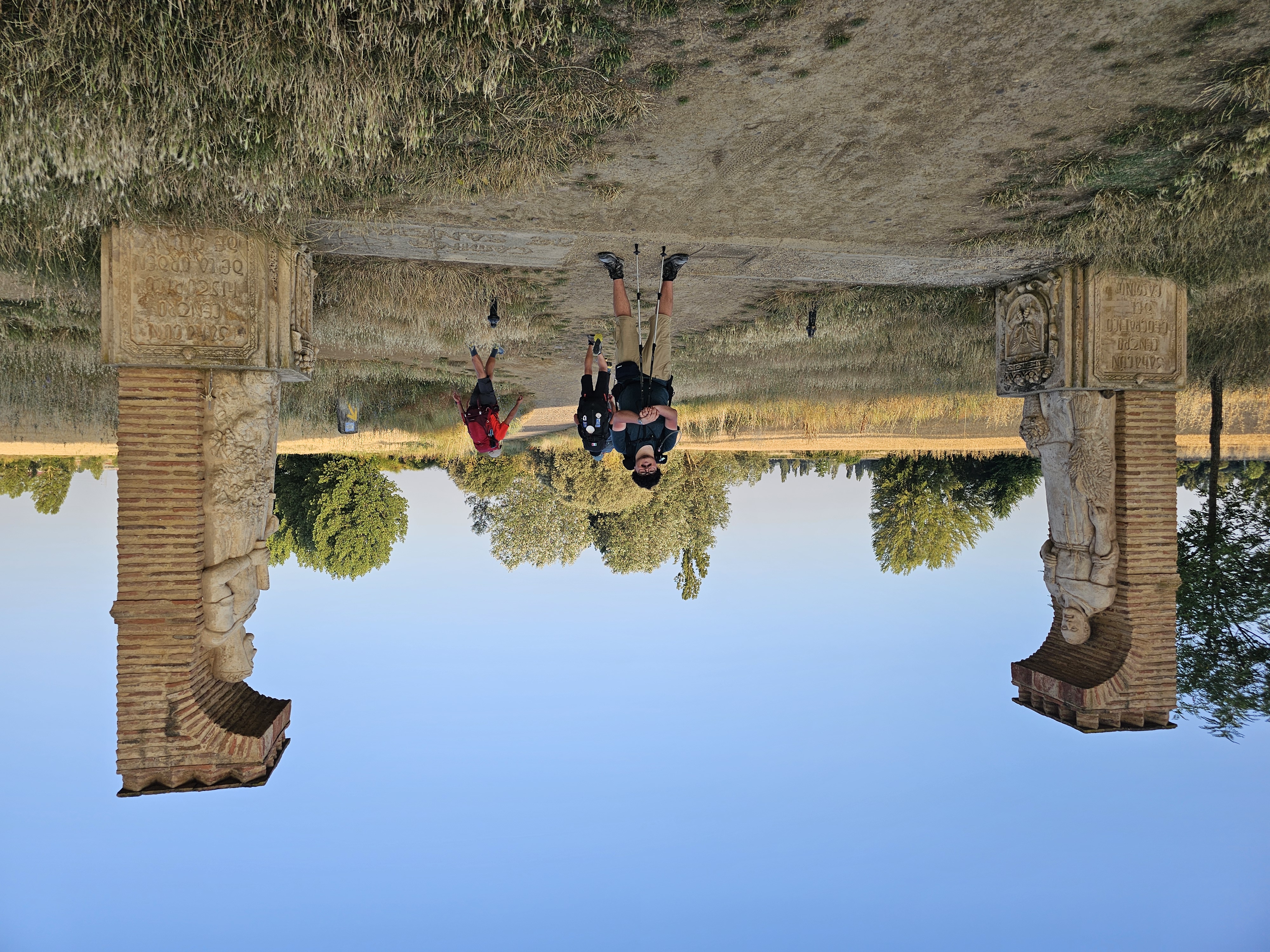 man standing at the halfway point of the camino de Santiago
